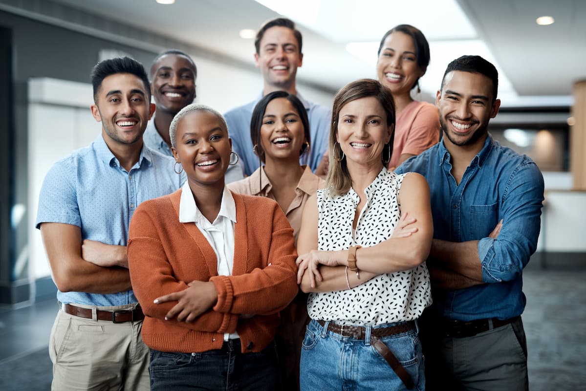 group of people smiling in an office